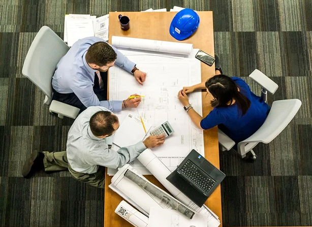 real estate syndication group meeting at a table